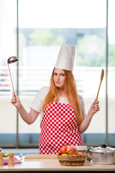 Redhead cook working in the kitchen — Stock Photo, Image