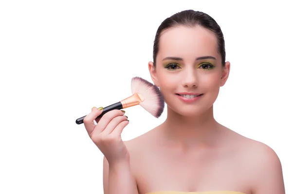 Mladá žena během relace make-up izolované na bílém — Stock fotografie