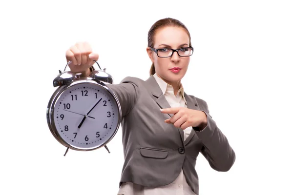 Mujer de negocios con reloj despertador gigante aislado en blanco Fotos de stock