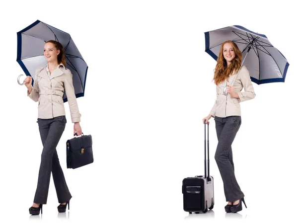 Young woman travelling with suitcase and umbrella isolated on wh — Stock Photo, Image