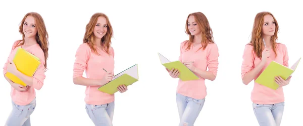 Joven estudiante con cuadernos aislados en blanco — Foto de Stock