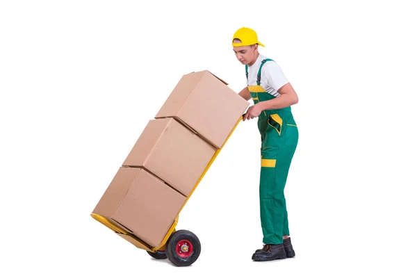 Молодий чоловік рухає коробки з візком ізольовано на білому — стокове фото