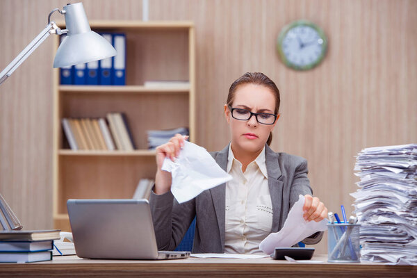 Busy stressful woman secretary under stress in the office