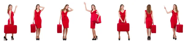 Jonge vrouw in rode jurk met koffer geïsoleerd op wit — Stockfoto