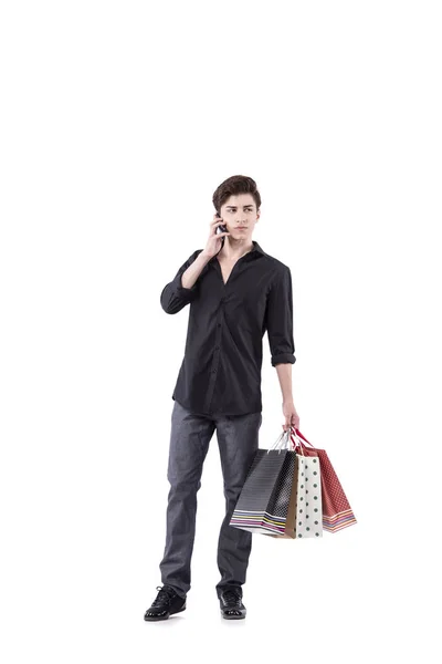 Młody człowiek w zakupy koncepcja na białym tle — Zdjęcie stockowe