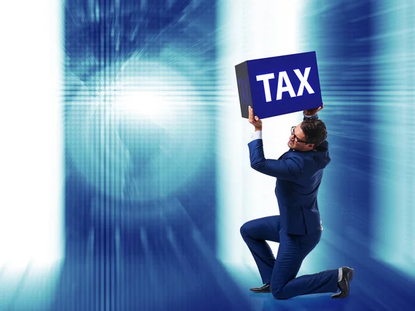 Man under the burden of tax payments — Stock Photo, Image