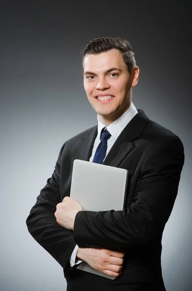 Man met laptop in business concept — Stockfoto