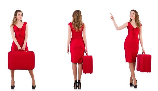 Giovane donna in abito rosso con valigia isolata su bianco — Foto Stock
