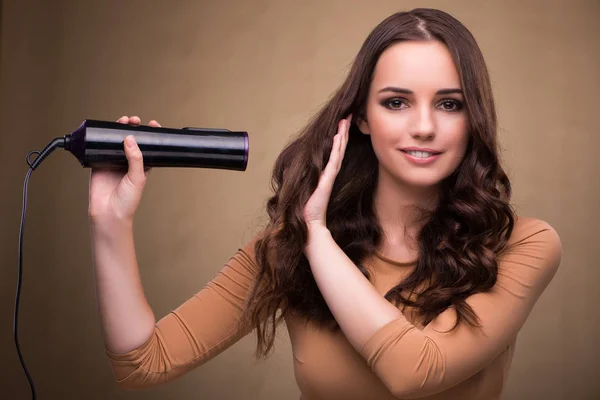 Beautiful woman with hair dryer — Stock Photo, Image