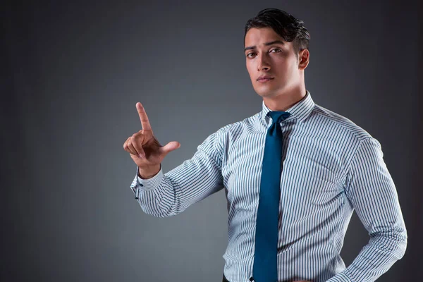 Hombre de negocios guapo presionando botones virtuales —  Fotos de Stock