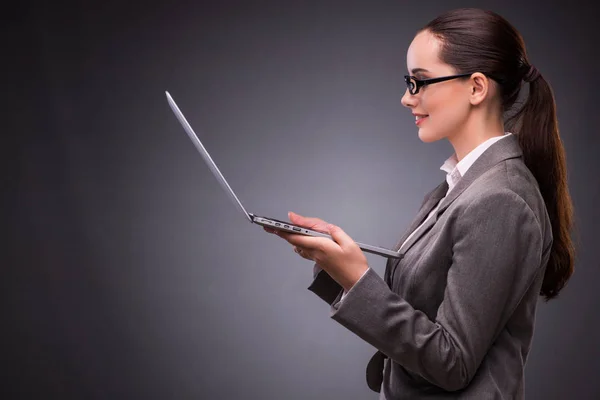 Businesswoman with laptop in business concept — Stock Photo, Image