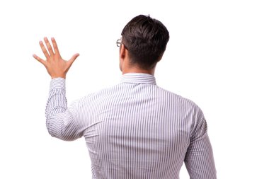 Genç yakışıklı işadamı beyaz izole düğmelere basarak