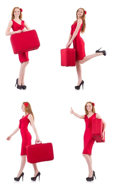 Jovem em vestido vermelho com mala isolada em branco — Fotografia de Stock