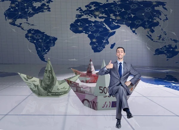 Businessman with dollar paper boats — Stock Photo, Image