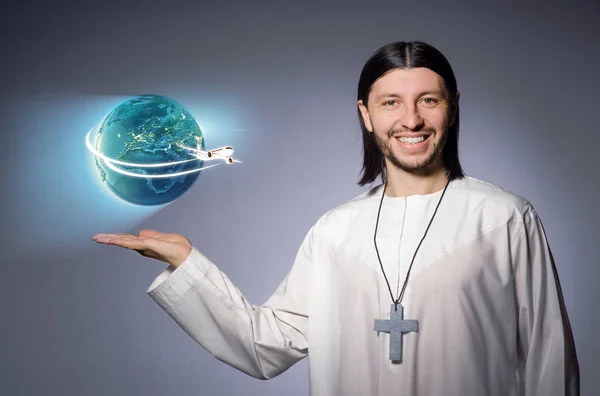 Young christian priest in air travel concept — Stock Photo, Image
