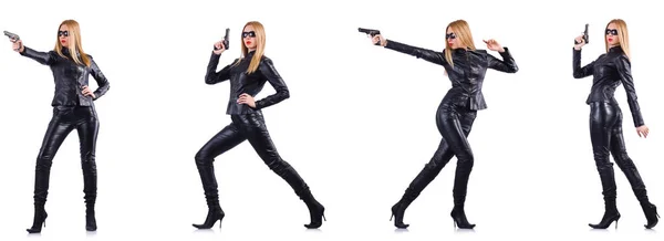 Kvinna i läder kostym med pistol isolerad på vit — Stockfoto