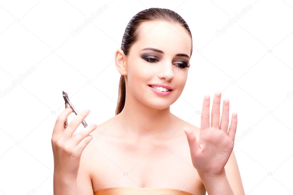 Young woman with scissors for nails isolated on white