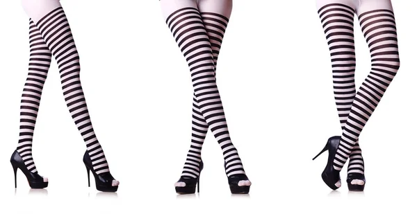 Bacaklar beyaz izole çizgili çorap ile — Stok fotoğraf