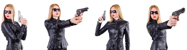 Vrouw in lederen kostuum met pistool geïsoleerd op wit — Stockfoto