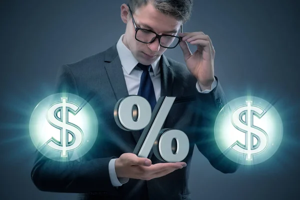 Businessman in high interest rates concept — Stock Photo, Image