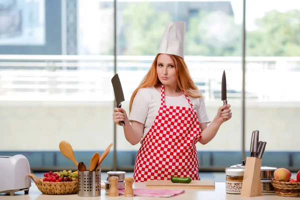 Redhead cook working in the kitchen — Stock Photo, Image