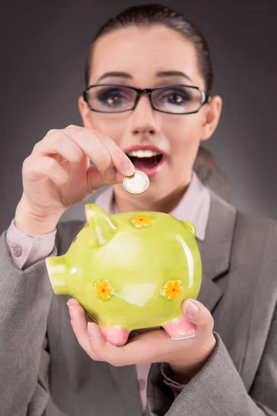 Business concept with businesswoman and piggy bank — Stock Photo, Image