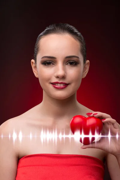 Woman in romantic concept with red heart — Stock Photo, Image