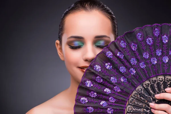 Beautiful woman with fan in fashion concept — Stock Photo, Image