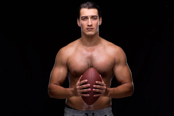 Ripped muscular man with american football — Stock Photo, Image