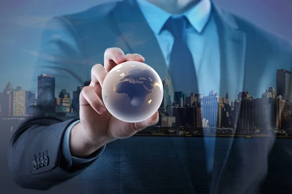 Businessman holding globe in global business concept Royalty Free Stock Photos