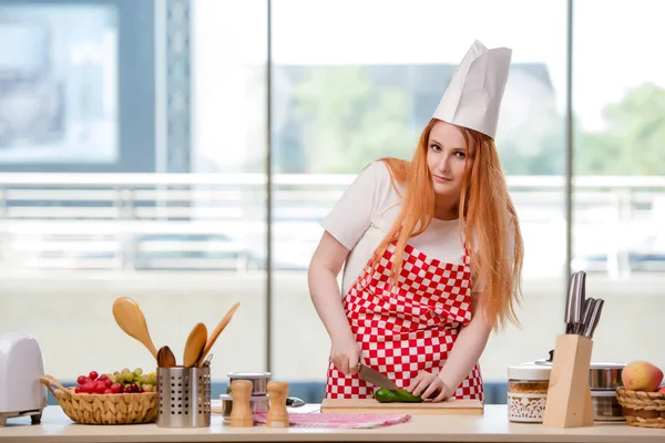 Redhead cook working in the kitchen — Stock Photo, Image