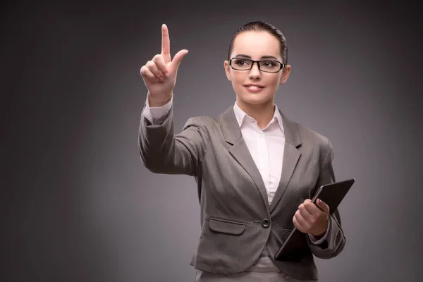 Young businesswoman pressing virtual button — Stock Photo, Image