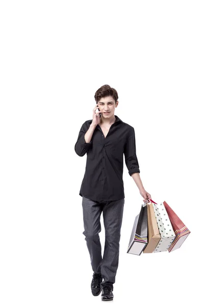 Young man in shopping concept isolated on white — Stock Photo, Image