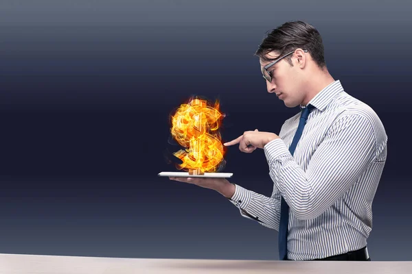 Businessman holding burning american dollar sign — Stock Photo, Image