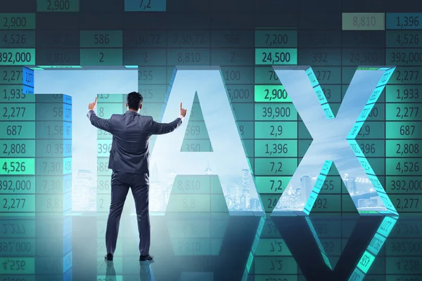 Businessman in high taxes concept — Stock Photo, Image