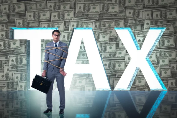 Businessman in tax burden business concept — Stock Photo, Image