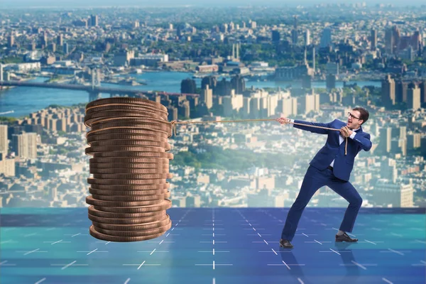 Businessman pulling stack of gold coins — Stock Photo, Image