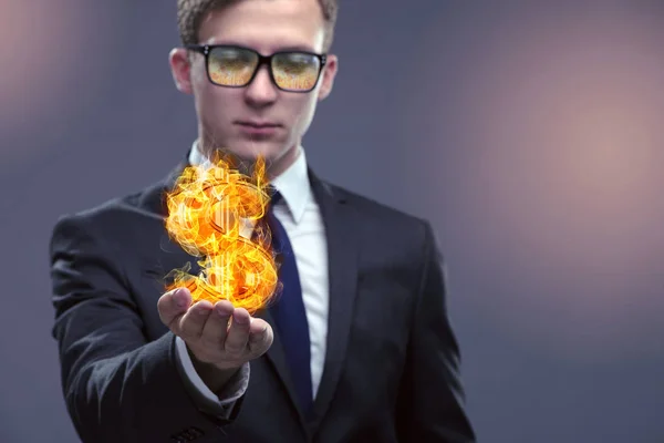 Businessman holding burning american dollar sign — Stock Photo, Image