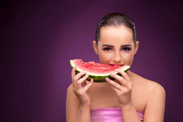 Beautiful woman eating tasty watermelon — Stock Photo, Image