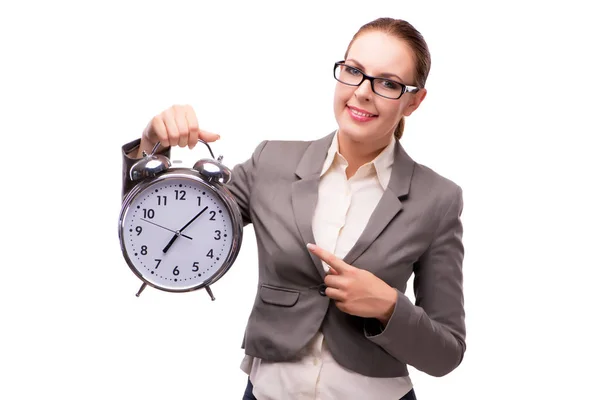 Mujer de negocios con reloj despertador gigante aislado en blanco Imagen de stock