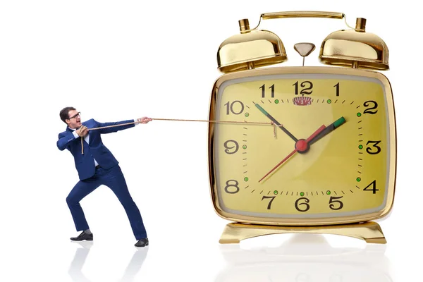 Businessman pulling clock in time concept — Stock Photo, Image