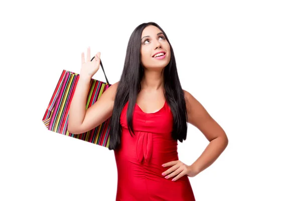 Woman in red dres after shopping isolated on white — Stock Photo, Image