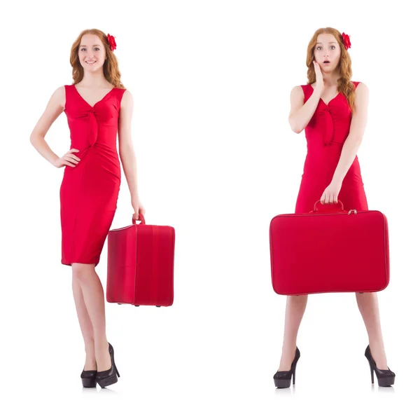 Young woman in red dress with suitcase isolated on white — Stock Photo, Image