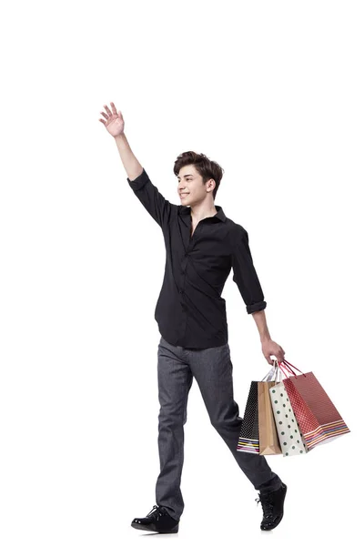 Jeune homme dans le shopping concept isolé sur blanc — Photo