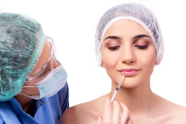 Jonge vrouw voorbereiden op plastische chirurgie geïsoleerd op wit — Stockfoto