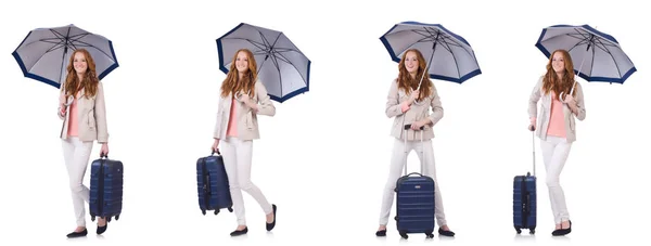 Young woman travelling with suitcase and umbrella isolated on wh — Stock Photo, Image