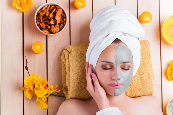 Young woman in spa health concept