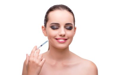 Genç kadın plastik cerrahi üzerine beyaz izole için hazırlanıyor