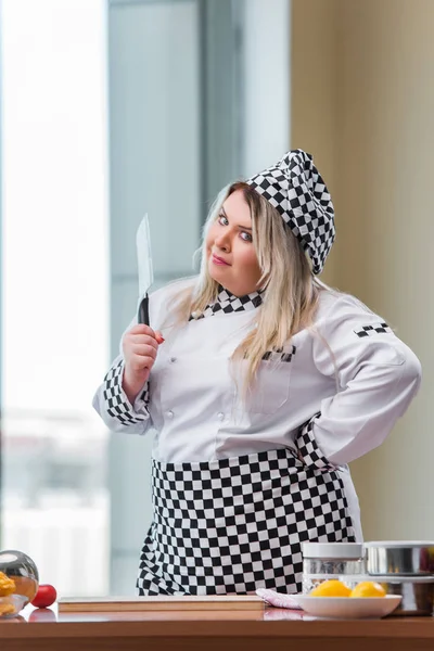 Young chef cook working in the kitchen — Stock Photo, Image