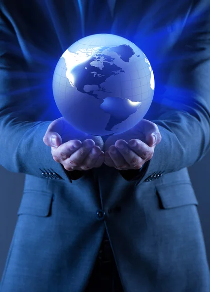 Businessman holding globe in global business concept — Stock Photo, Image